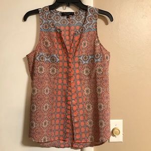 Sleeveless hip length coral/blue top